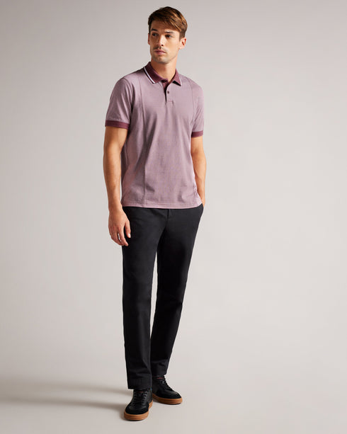 TAIGAA-Tops-Not your average polo shirt, TAIGAA kicks things up a notch with its all over striped print and solid trims. Perfect for casual Fridays and city exploring, this shirt teams brilliantly with anything from denim to chinos and beyond.By choosing Ted Baker cotton products, you're supporting our investment in the Better Cotton Initiative's mission. This product is sourced via a system of mass balance and therefore may not contain Better Cotton. Polo shirt 100% cotton Stripe print Regular fit Short sl